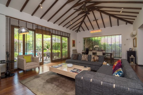 Modern kitchen and living room with pool entrance