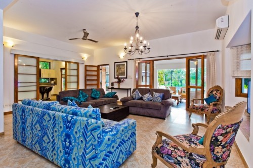 Spacious living room with sofa and TV